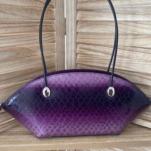 Beautiful purple Vittorio bag.  Fun shape.  Like new condition